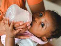 baby being fed bottle